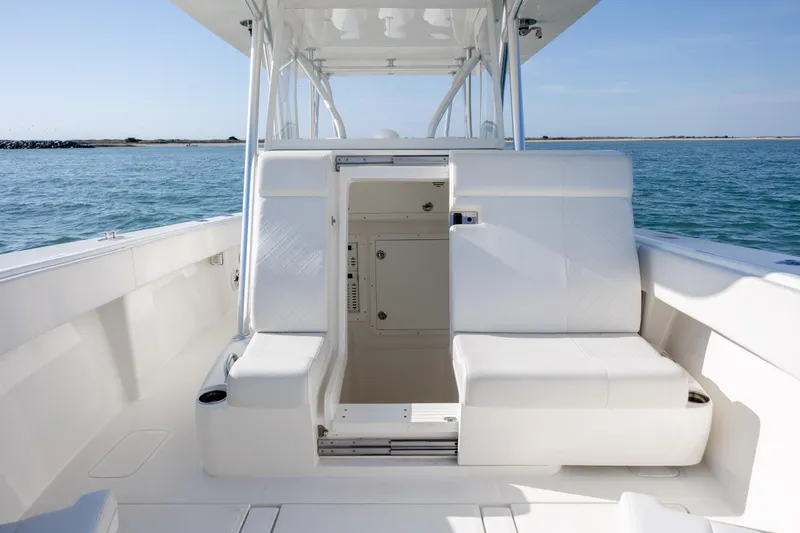 Slide: The Image of 2019 SeaVee 370Z boat interior with white seating, open water view. - 27