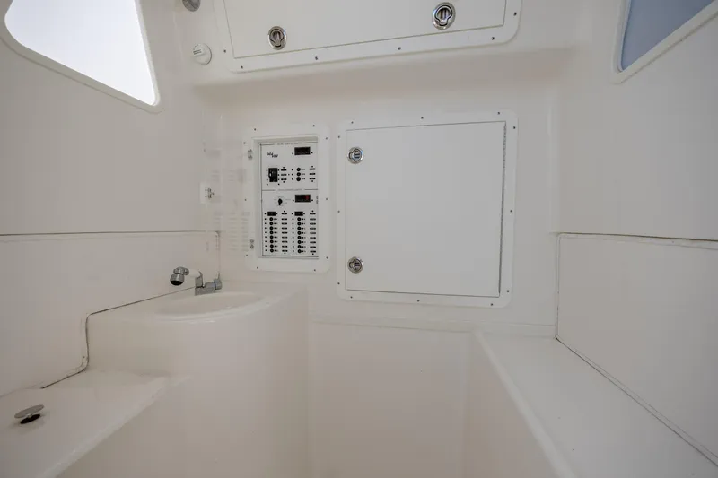 Slide: The Image of 2019 SeaVee 370Z interior with control panel and sink. - 28