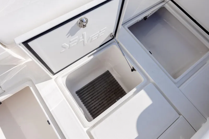 Slide: The Image of Storage compartments on a 2019 SeaVee 370Z boat, featuring open hatches and clean design. - 33