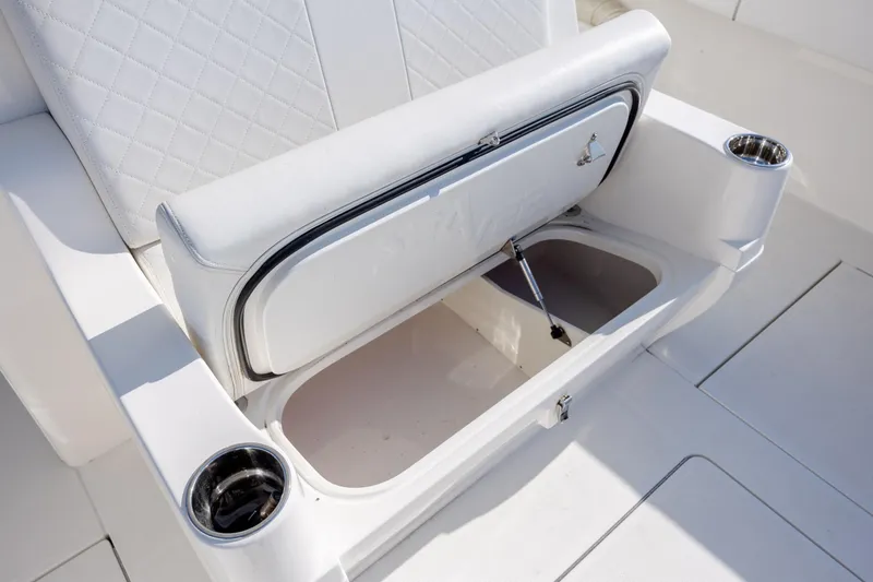 Slide: The Image of White leather seating with storage compartment on 2019 SeaVee 370Z boat. - 36