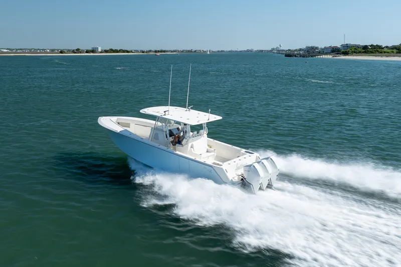 Slide: The Image of 2019 SeaVee 370Z boat cruising on open water, showcasing speed and performance. - 37