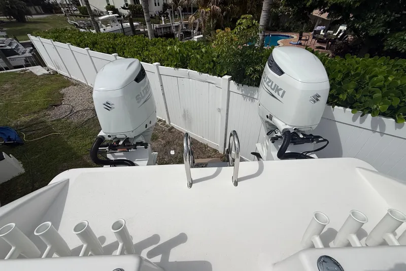 Slide: The Image of Twin Vee 280 GFX CC 2022 boat with dual Suzuki outboard motors. - 27