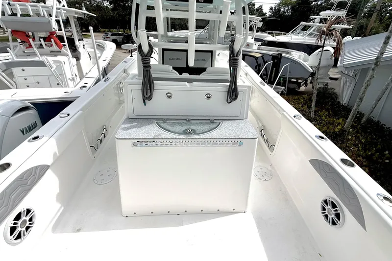 Slide: The Image of 2022 Twin Vee 280 GFX CC boat interior with Garmin electronics and Yamaha engine. - 29