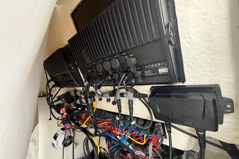 Slide: The Image of Electrical wiring and equipment inside a 2022 Twin Vee 280 GFX CC boat. - 41