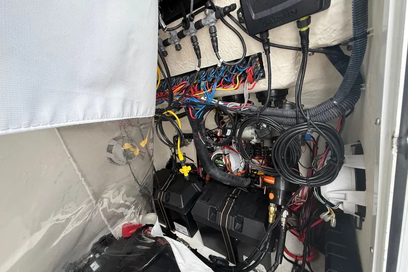 Slide: The Image of Electrical wiring and components inside a 2022 Twin Vee 280 GFX CC boat. - 42
