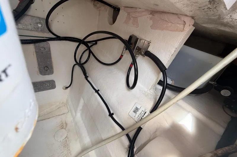 Slide: The Image of Interior view of 2022 Twin Vee 280 GFX CC boat wiring and components. - 46