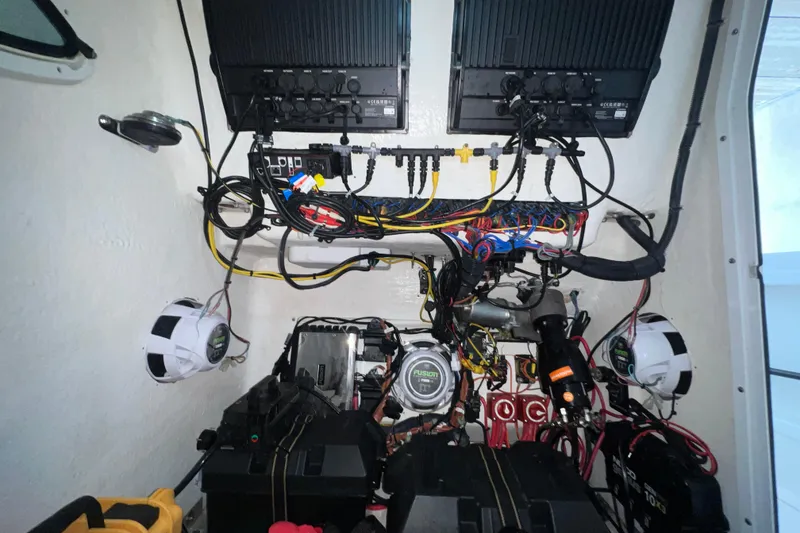 Slide: The Image of Electrical system setup in 2022 Twin Vee 280 GFX CC boat, featuring wiring and components. - 9
