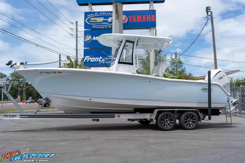 The Image of 2023 Sea Hunt Ultra 239 SE boat on trailer at dealership. - 0