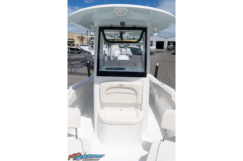 Slide: The Image of 2023 Sea Hunt Ultra 239 SE boat interior with seating and helm station. - 22