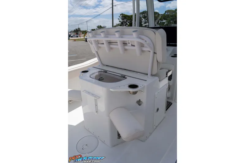 Slide: The Image of 2023 Sea Hunt Ultra 239 SE boat interior with seating and storage compartments. - 26
