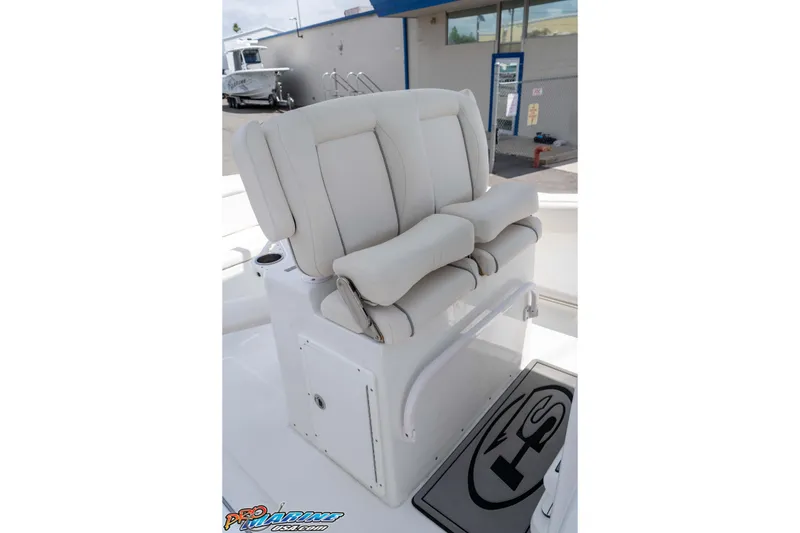 Slide: The Image of 2023 Sea Hunt Ultra 239 SE boat seat with cushioned backrest and armrests. - 27