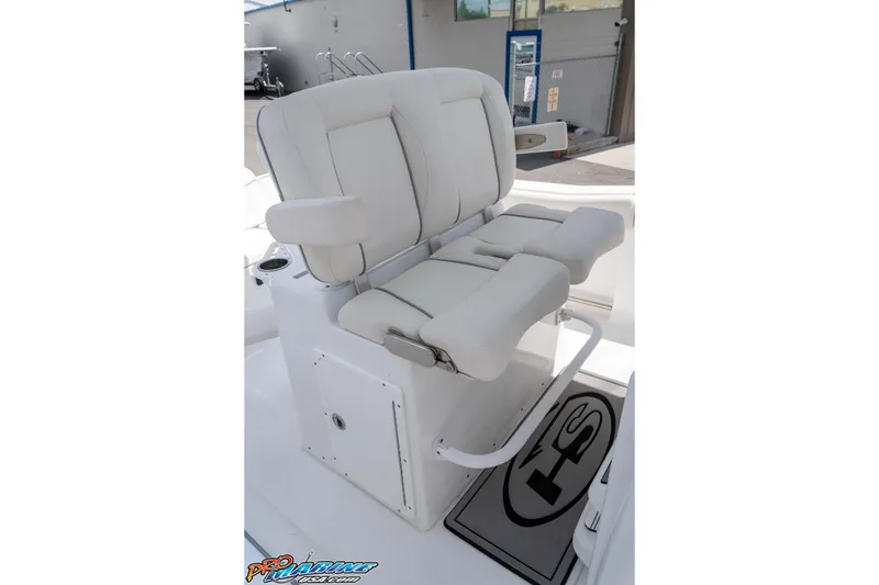 Slide: The Image of 2023 Sea Hunt Ultra 239 SE boat seat with white cushioned design and armrests. - 28