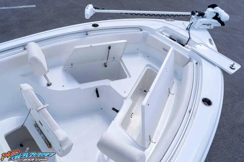 Slide: The Image of 2023 Sea Hunt Ultra 239 SE boat interior with storage compartments and seating. - 33