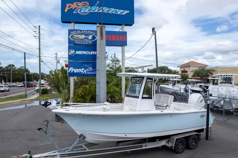Slide: The Image of 2023 Sea Hunt Ultra 239 SE boat on trailer at Pro Marine dealership. - 36