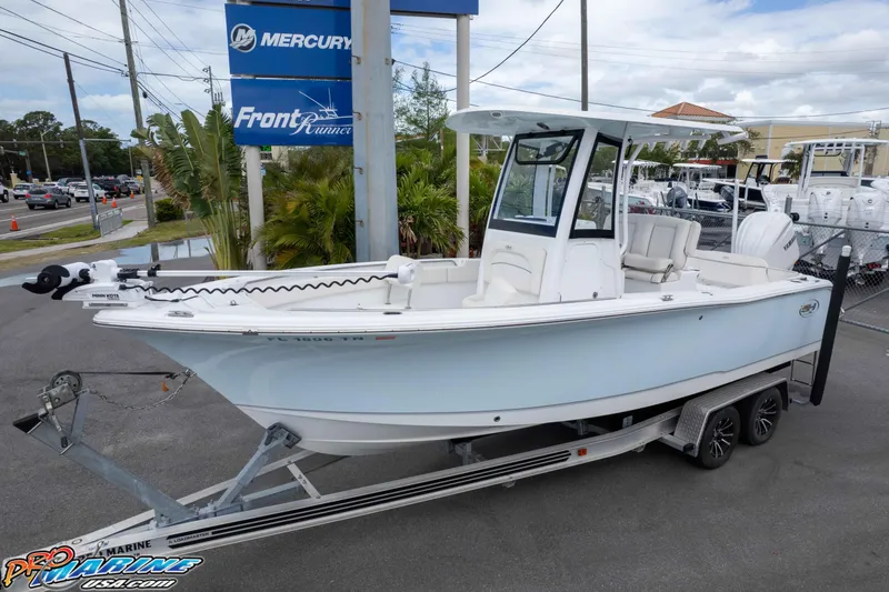 Slide: The Image of 2023 Sea Hunt Ultra 239 SE boat on trailer at dealership. - 38
