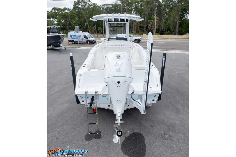 Slide: The Image of 2023 Sea Hunt Ultra 239 SE boat, rear view with outboard motor and ladder. - 42