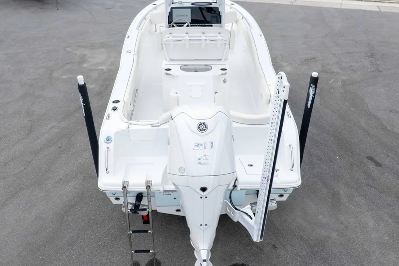 Slide: The Image of 2023 Sea Hunt Ultra 239 SE boat, rear view with motor and ladder. - 43