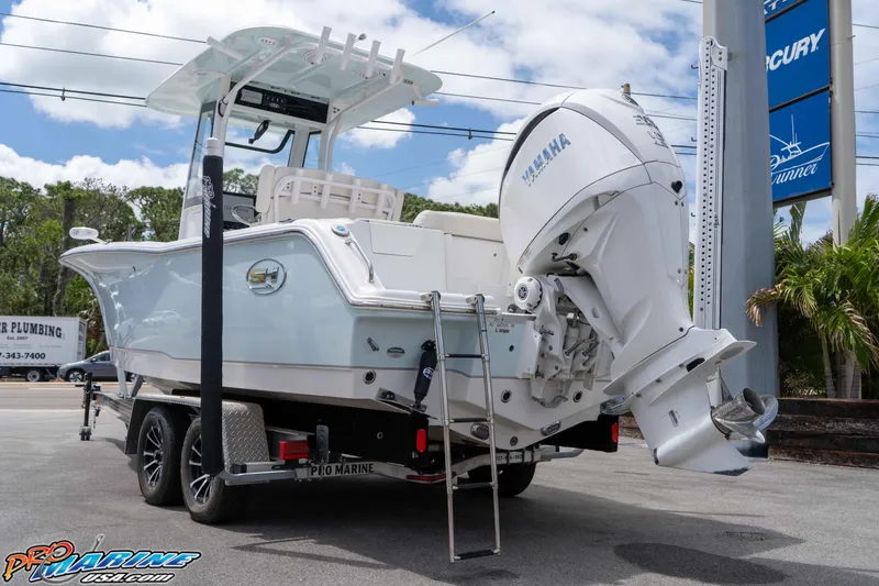 Slide: The Image of 2023 Sea Hunt Ultra 239 SE boat on trailer with Yamaha engine. - 5