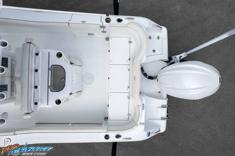 Slide: The Image of 2023 Sea Hunt Ultra 239 SE boat interior with seating and motor, top view. - 51