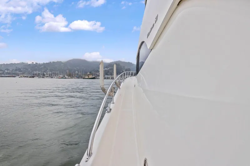 Slide: The Image of Side view of a 2014 Maritimo M50 yacht on calm waters under a blue sky. - 24