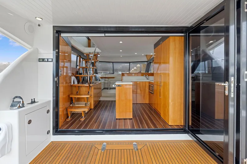 Slide: The Image of Luxurious interior of 2014 Maritimo M50 yacht with wooden flooring and modern kitchen. - 31