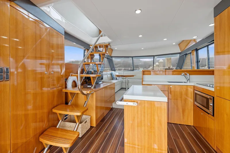 Slide: The Image of Luxurious interior of 2014 Maritimo M50 yacht with modern kitchen and wooden finishes. - 32