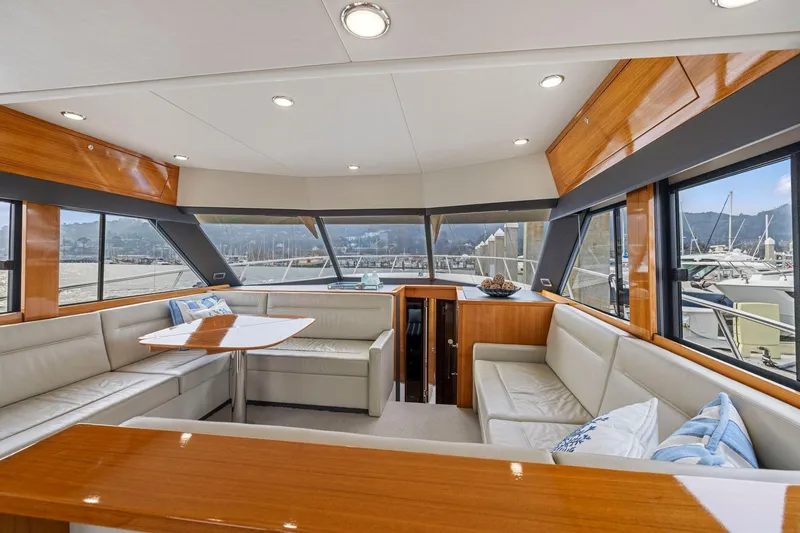 Slide: The Image of Luxurious interior of 2014 Maritimo M50 yacht with elegant seating and panoramic windows. - 36