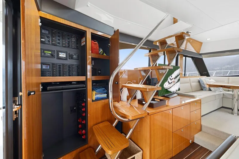 Slide: The Image of Interior of 2014 Maritimo M50 yacht featuring wooden cabinetry and modern staircase design. - 41