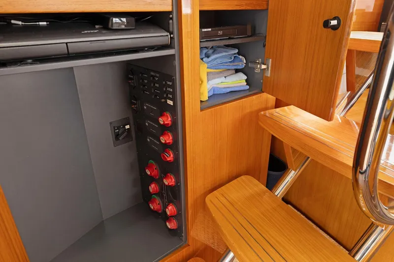 Slide: The Image of 2014 Maritimo M50 yacht interior with wooden cabinetry and storage compartments. - 42