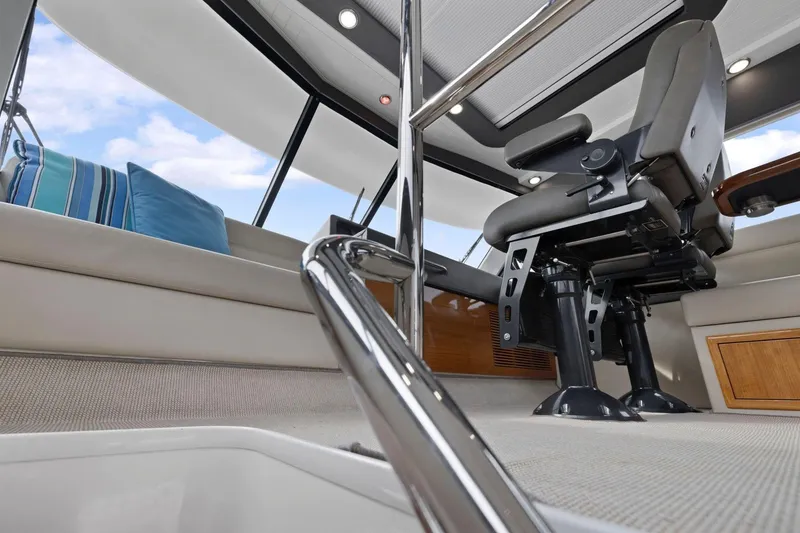 Slide: The Image of 2014 Maritimo M50 yacht interior with captain's chair and modern design elements. - 44