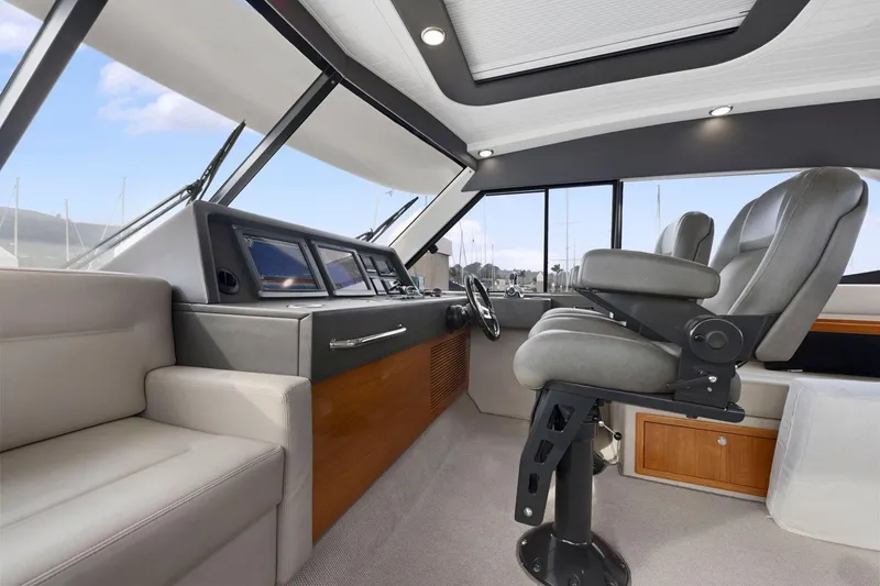 Slide: The Image of Luxurious interior of 2014 Maritimo M50 yacht with modern helm and seating. - 45