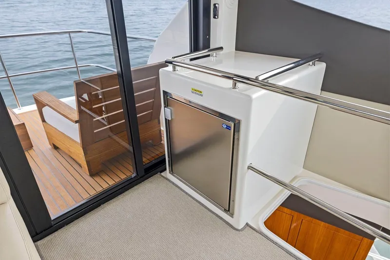 Slide: The Image of Interior view of 2014 Maritimo M50 yacht, featuring sleek design and outdoor seating area. - 51