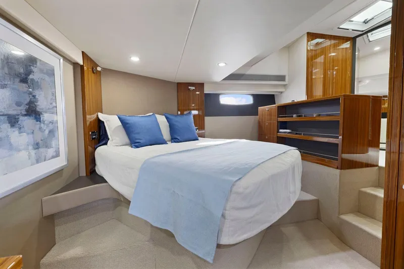 Slide: The Image of Luxurious cabin interior of 2014 Maritimo M50 yacht with elegant bedding and wood finishes. - 60