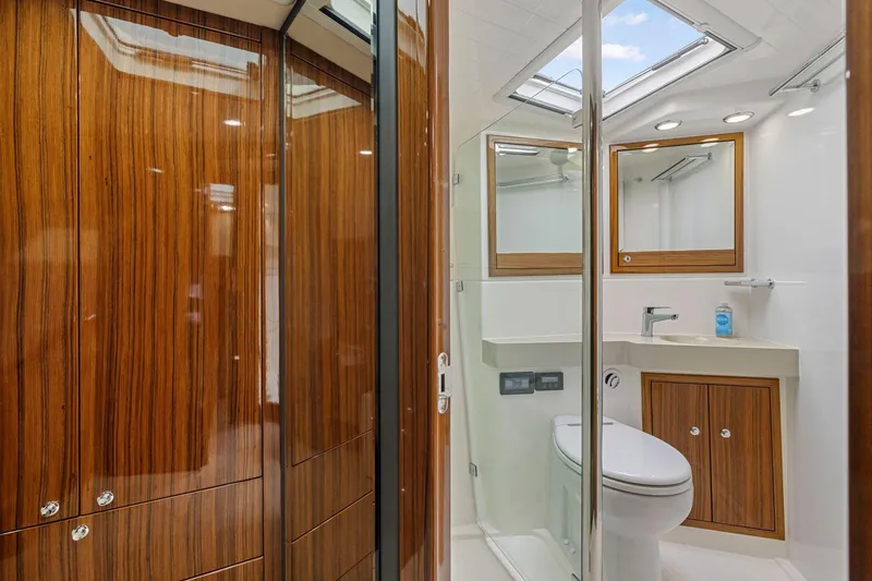 Slide: The Image of Luxurious bathroom in 2014 Maritimo M50 yacht with wood accents and modern fixtures. - 63