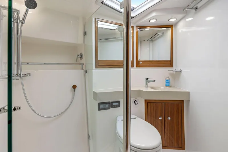 Slide: The Image of Luxurious 2014 Maritimo M50 yacht bathroom with modern fixtures and wooden accents. - 64