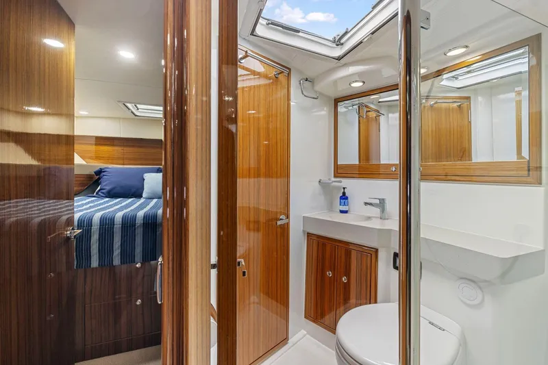 Slide: The Image of Luxurious 2014 Maritimo M50 yacht interior with wood accents and modern bathroom. - 67
