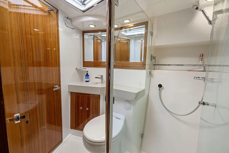 Slide: The Image of Luxurious bathroom in 2014 Maritimo M50 yacht with wood accents and modern fixtures. - 68