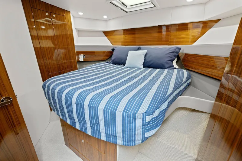 Slide: The Image of Luxurious cabin interior of 2014 Maritimo M50 yacht with striped bedding. - 71