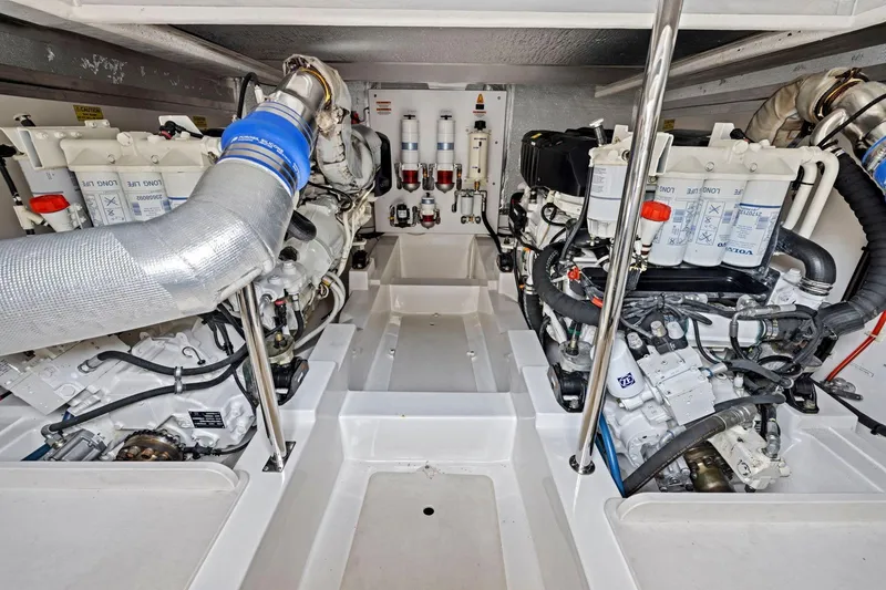 Slide: The Image of Engine room of 2014 Maritimo M50 yacht, showcasing dual engines and mechanical components. - 72