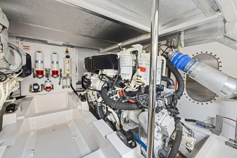 Slide: The Image of Engine room of 2014 Maritimo M50 yacht, showcasing mechanical components and systems. - 73