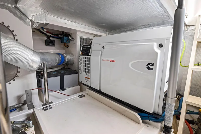 Slide: The Image of Engine room of 2014 Maritimo M50 yacht with Cummins Onan generator. - 76