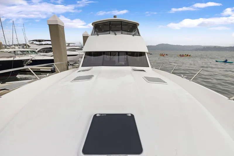 Slide: The Image of 2014 Maritimo M50 yacht docked at marina with scenic water view. - 80