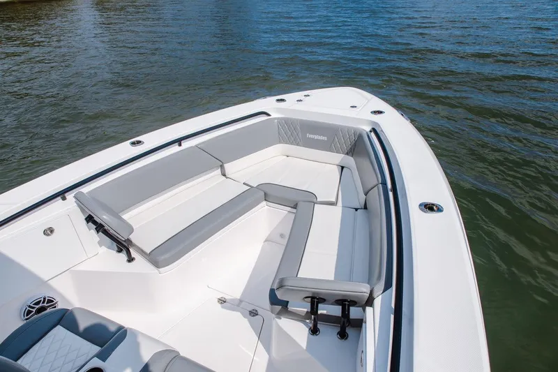 Slide: The Image of 2026 Everglades 335 Center Console boat with spacious seating on calm water. - 10