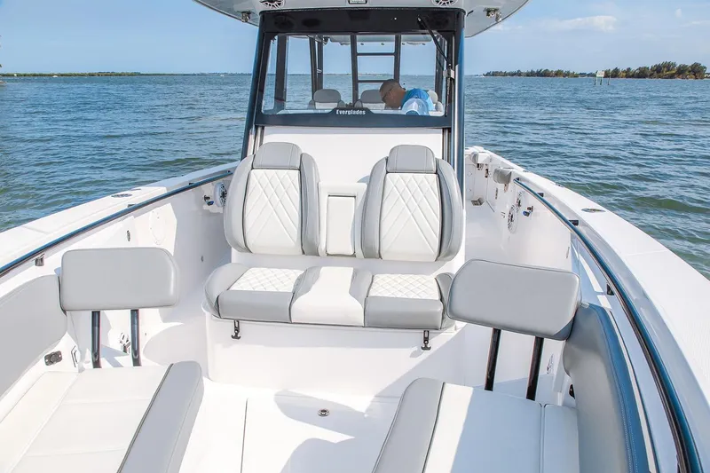 Slide: The Image of Manufacturer Provided Image: 2026 Everglades 335 Center Console boat interior with luxurious seating on open water. - 13