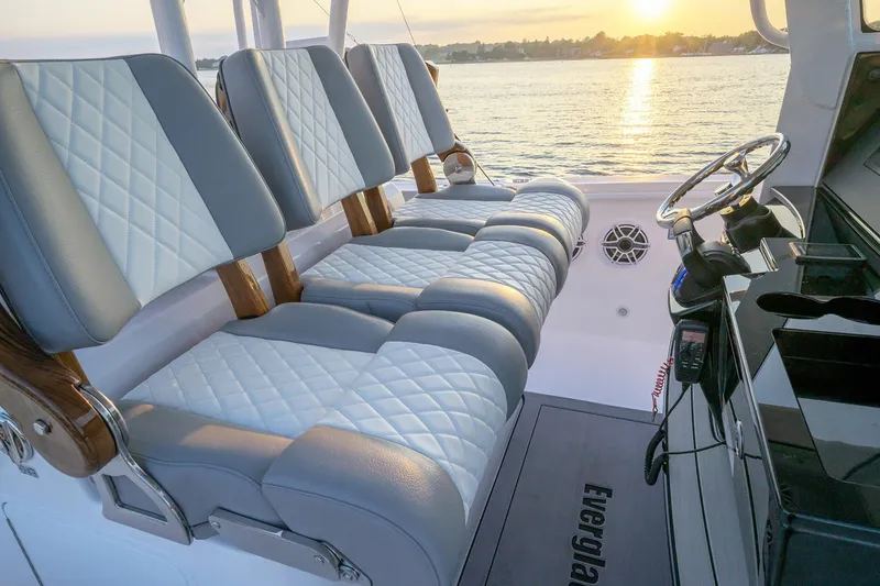 Slide: The Image of Manufacturer Provided Image: Luxurious seating on 2026 Everglades 335 Center Console boat at sunset. - 16