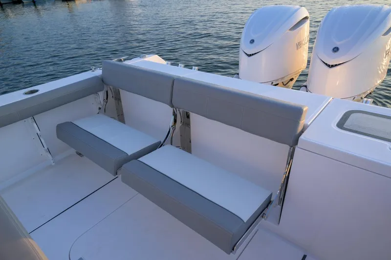 Slide: The Image of 2026 Everglades 335 Center Console boat with dual engines and comfortable seating. - 18
