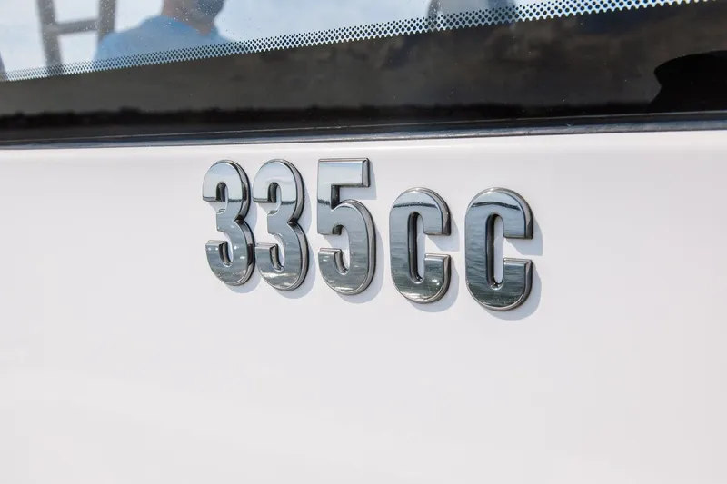 Slide: The Image of Chrome "335 CC" emblem on 2026 Everglades Center Console boat. - 22