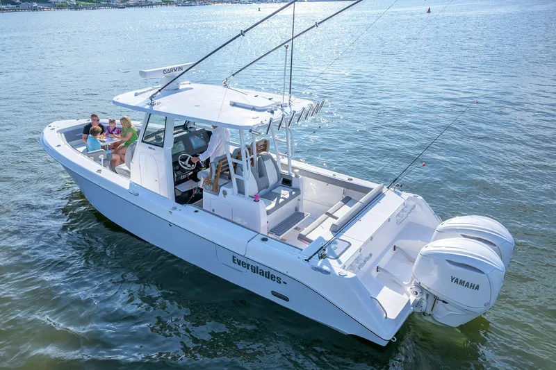 Slide: The Image of Manufacturer Provided Image: 2026 Everglades 335 Center Console boat on water with passengers enjoying a sunny day. - 5