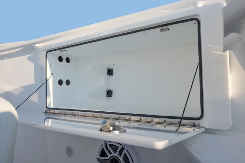 Slide: The Image of Open storage compartment on 2026 Everglades 335 Center Console boat. - 27