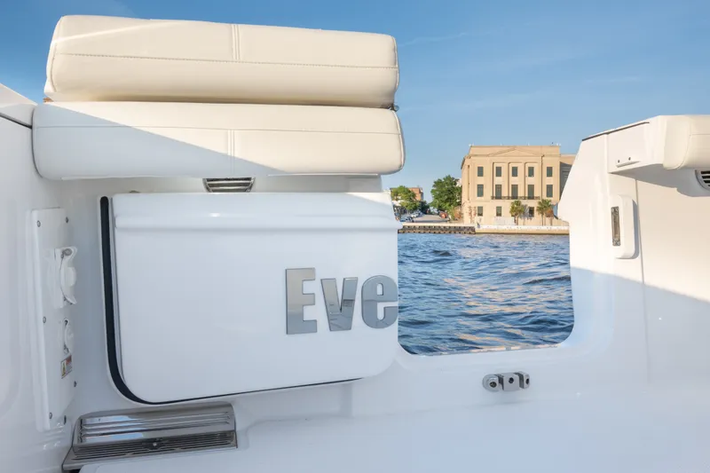 Slide: The Image of 2026 Everglades 335 Center Console boat interior with waterfront view. - 21